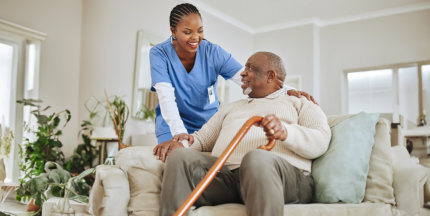 aide smiling at the senior man