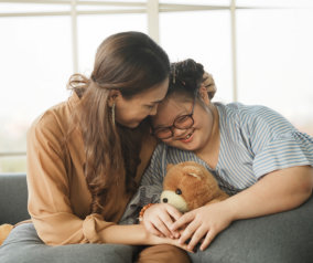woman and girl smiling