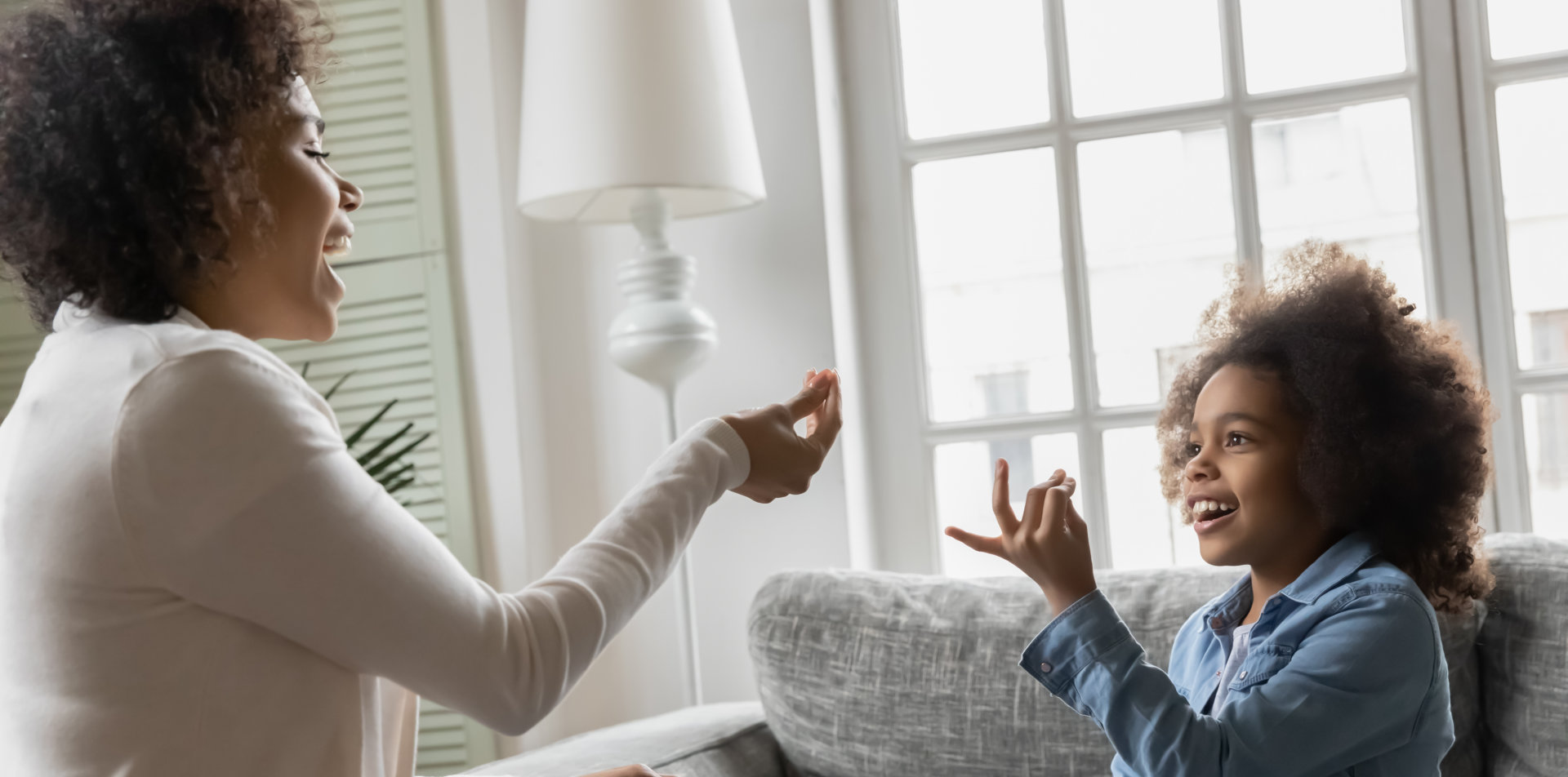 woman and kid smiling together