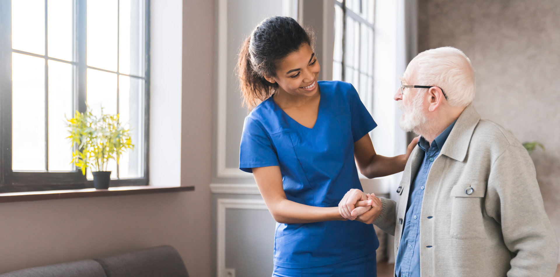 aide taking care of the senior man