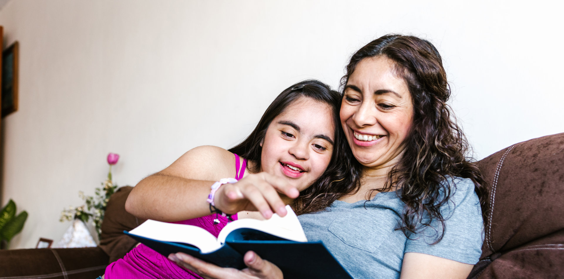 woman and girl smiling together
